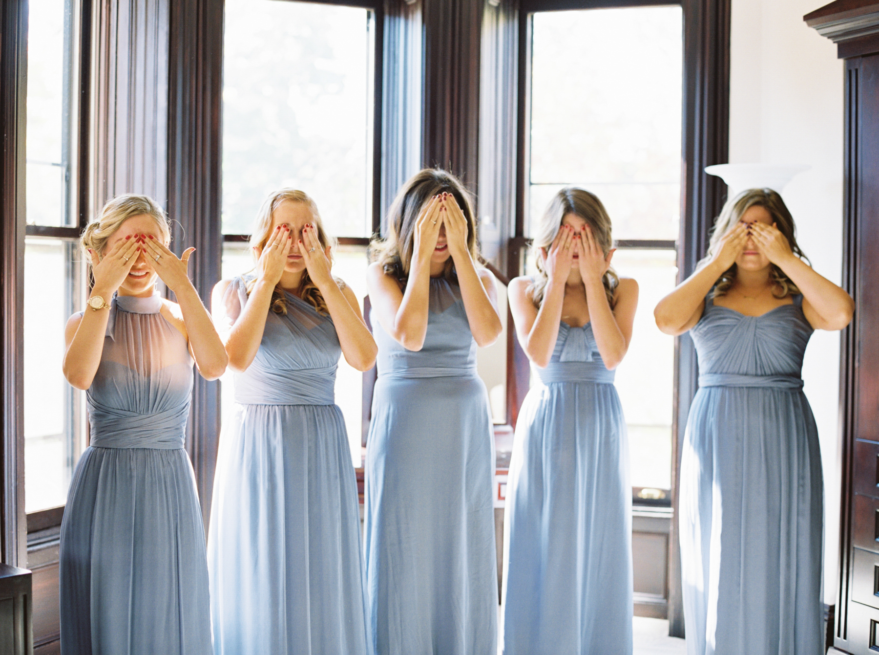 bridesmaids cover eyes waiting to see bride  captured by Chicago Wedding Photographer