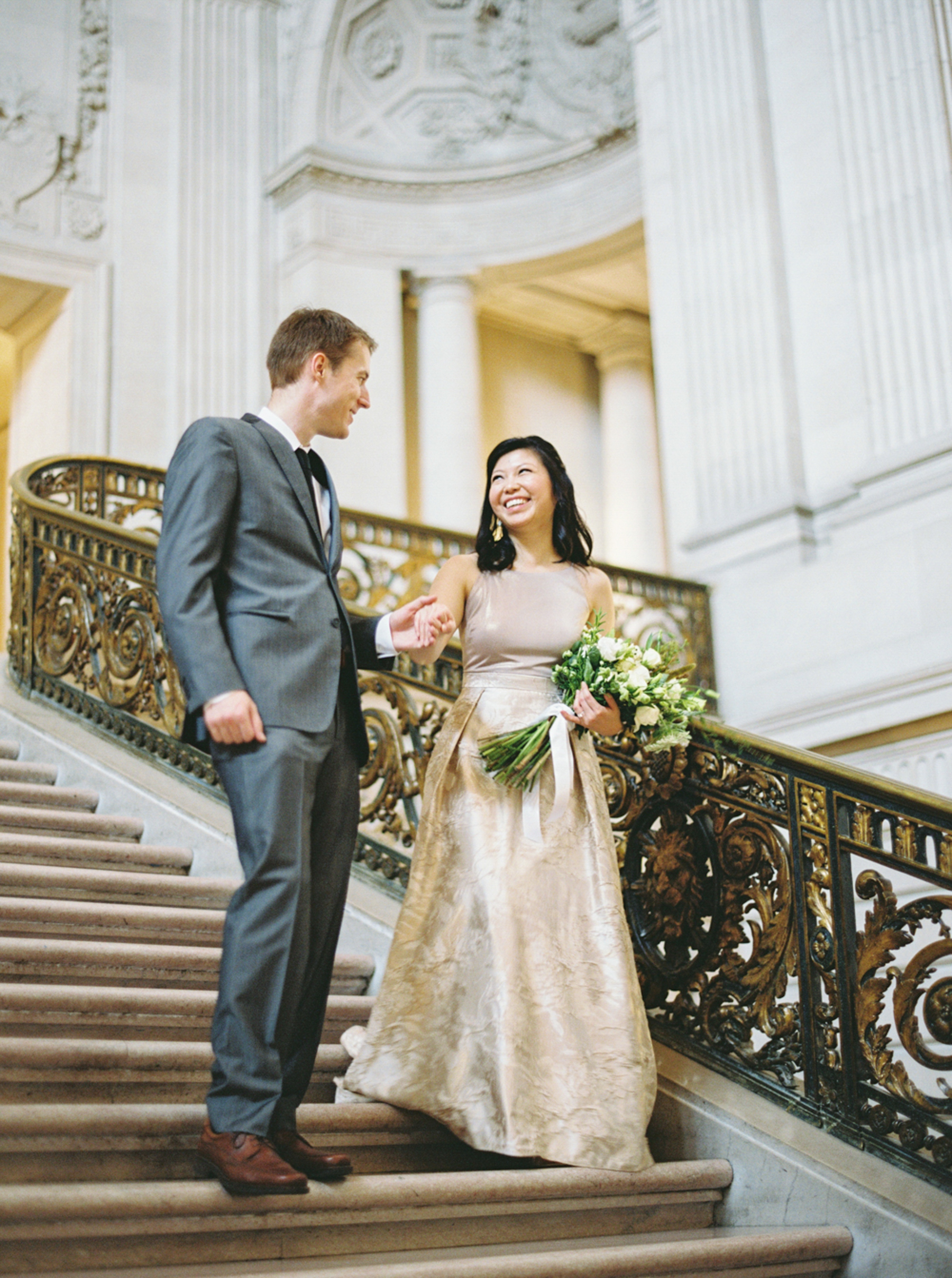 engaged couple on grand staircase San Francisco City Hall Engagement Session