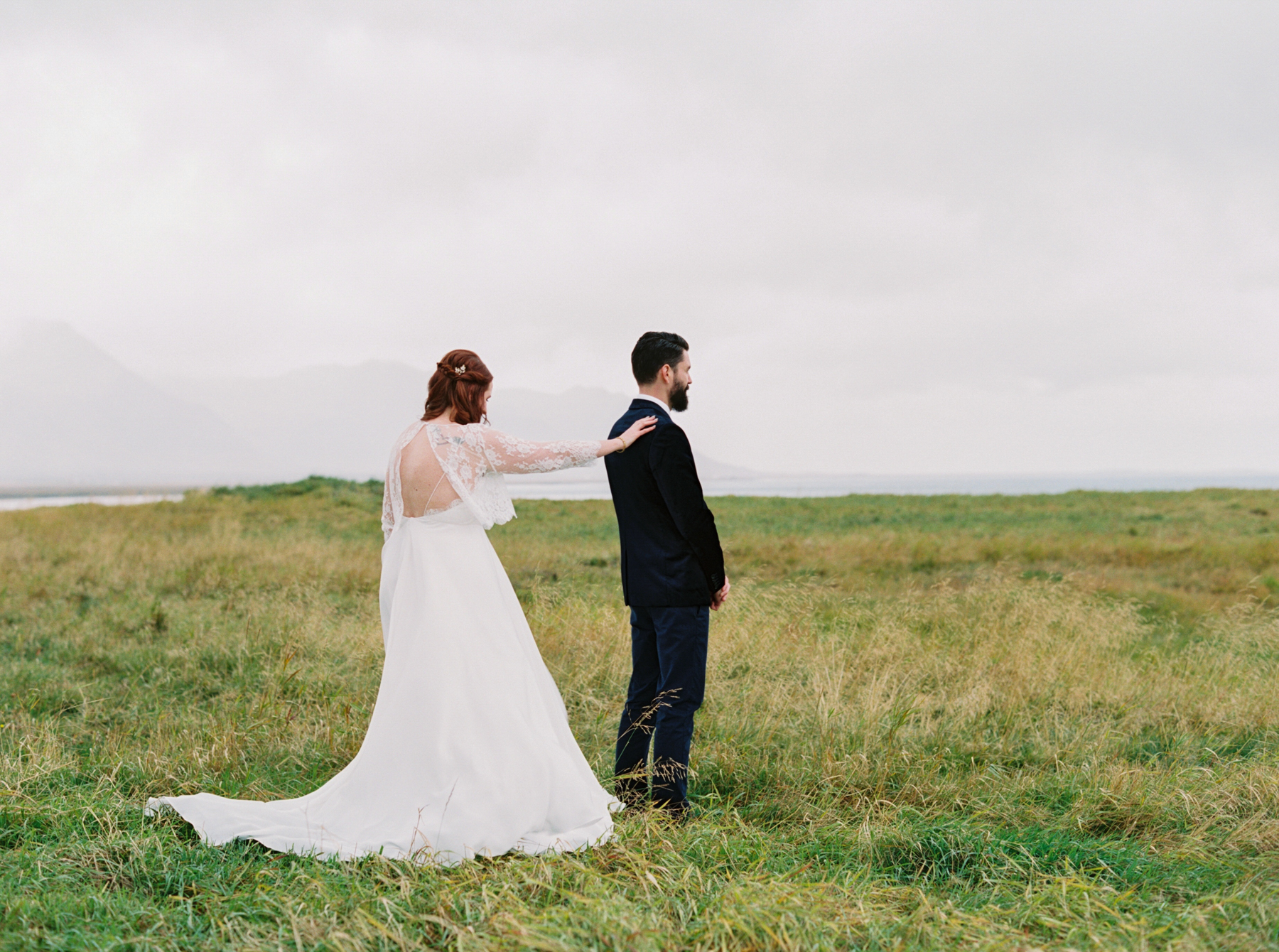 bride and groom do first look in Iceland before Iceland Wedding At Hotel Budir & the Black Church