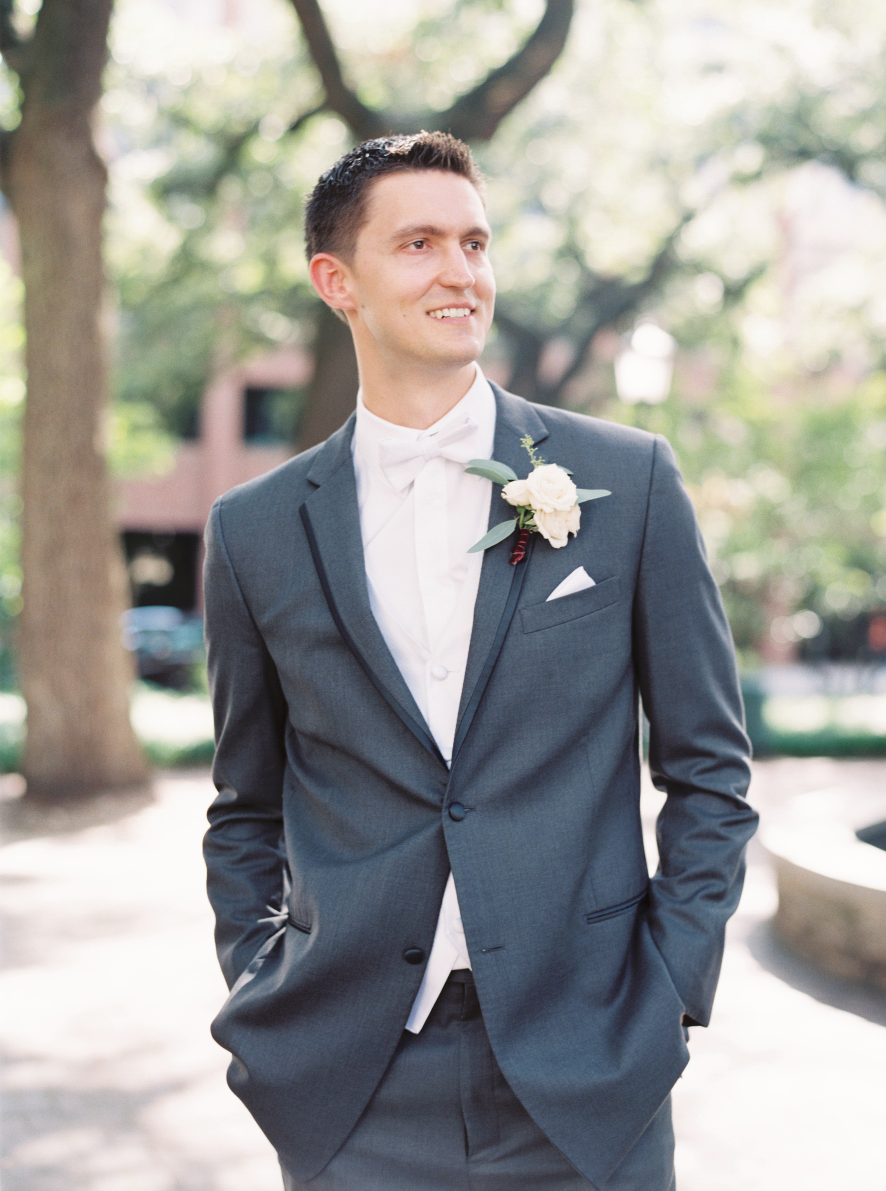 groom posing with hands in pockets before Savannah Georgia Wedding