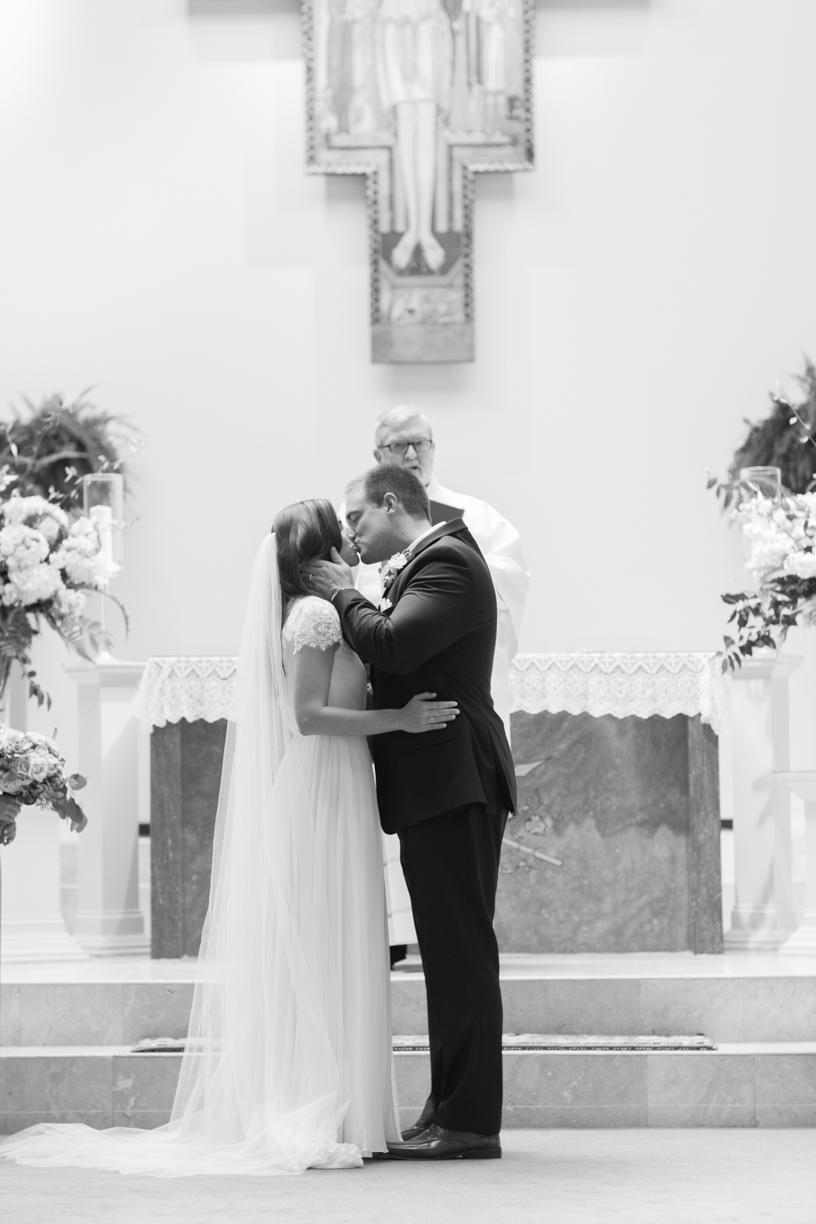 Saint Simon Island Wedding Photography bride & groom kissing at altar