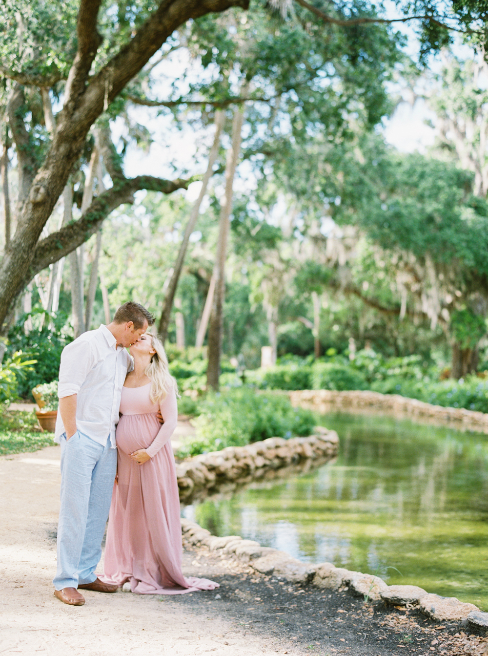 pink long dress for maternity photo shoot