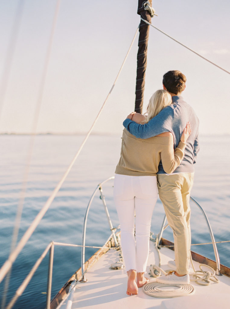engagement session on boat sailboat tampa fine art film wedding photographer